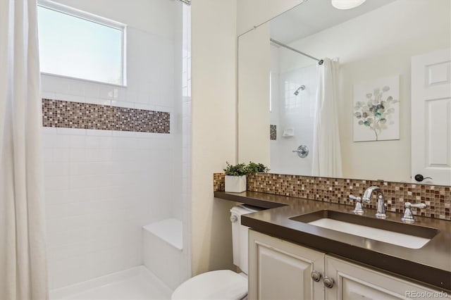 6927 Winter Ridge Pl, Castle Pines, CO 80108 - full bath with toilet, vanity, backsplash, and a tile shower
