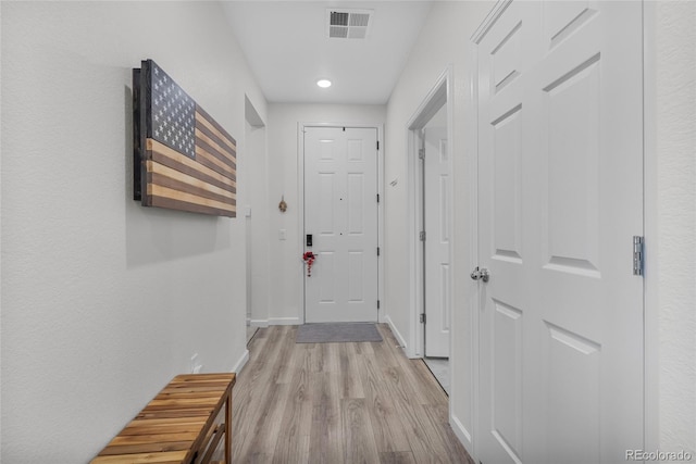 hallway with light wood-type flooring