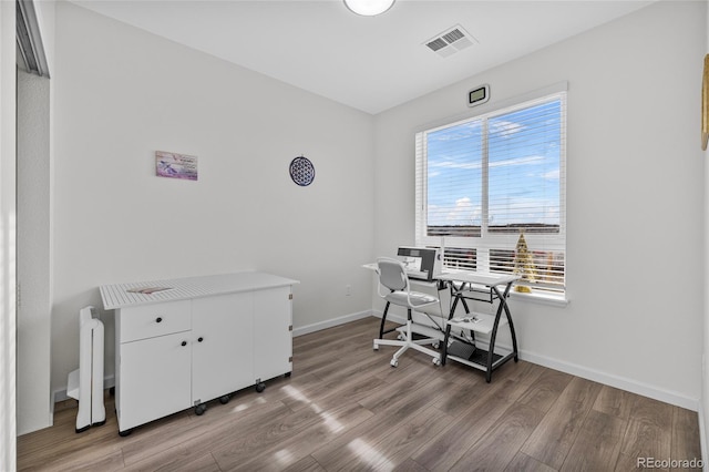 home office featuring light hardwood / wood-style floors