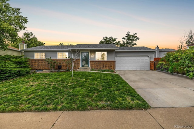 11886 Birch Dr, Thornton, CO 80233 - ranch-style house with brick siding, an attached garage, a yard, and driveway