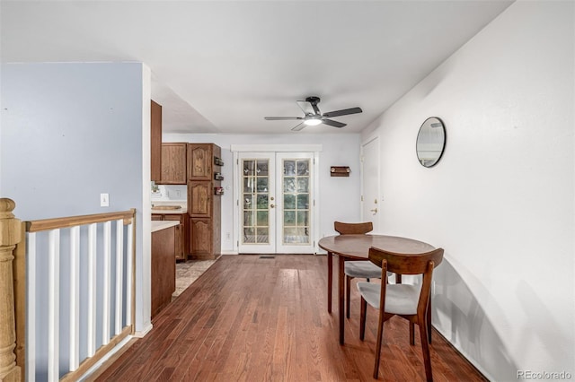 11886 Birch Dr, Thornton, CO 80233 - dining area featuring ceiling fan, dark wood-style floors, and french doors