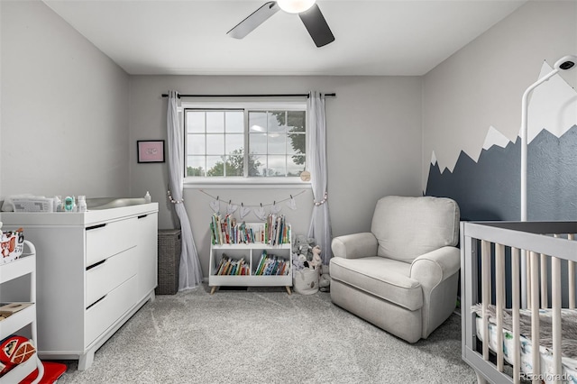 11886 Birch Dr, Thornton, CO 80233 - bedroom featuring light colored carpet, a crib, and ceiling fan