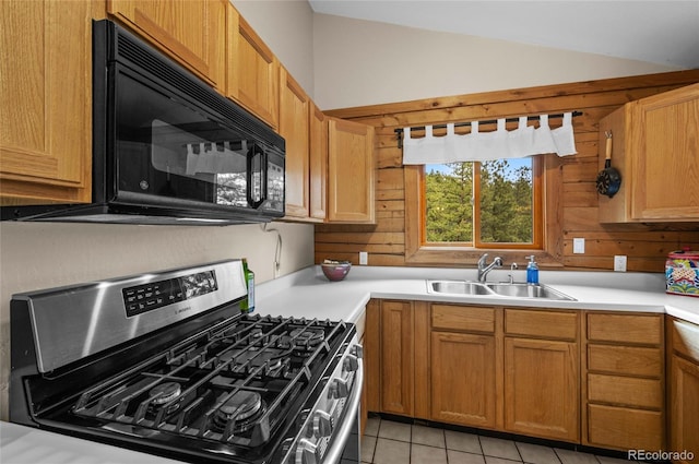 310 Wendelyn Way, Boulder, CO 80302 - kitchen with stainless steel range with gas cooktop, a sink, black microwave, vaulted ceiling, and light countertops