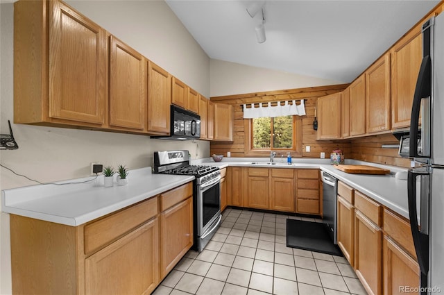 310 Wendelyn Way, Boulder, CO 80302 - kitchen featuring black appliances, a sink, lofted ceiling, light tile patterned floors, and light countertops
