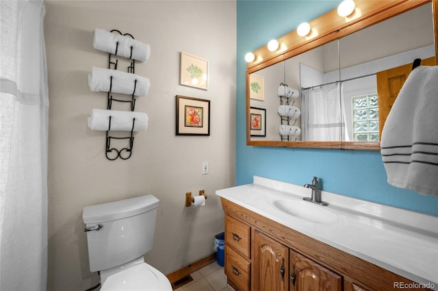 310 Wendelyn Way, Boulder, CO 80302 - full bathroom featuring toilet, vanity, baseboards, and tile patterned flooring