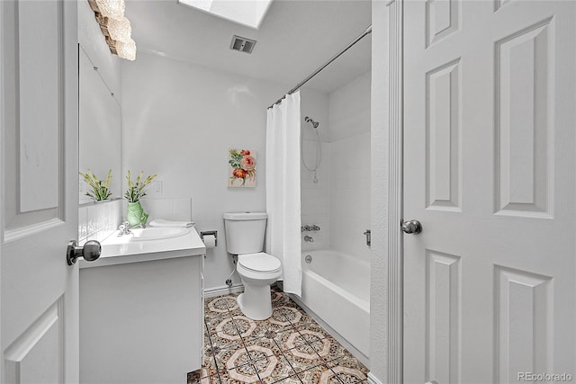 full bath featuring toilet, shower / bath combo, baseboards, tile patterned flooring, and vanity
