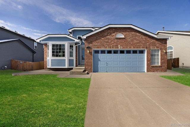 ranch-style home with concrete driveway, brick siding, and a front lawn