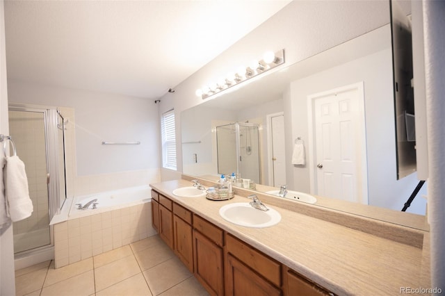 full bath with a shower stall, a garden tub, tile patterned floors, and a sink