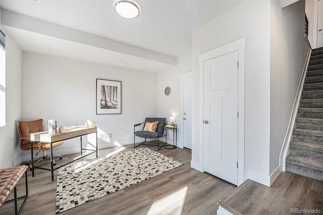 office featuring visible vents, baseboards, and wood finished floors