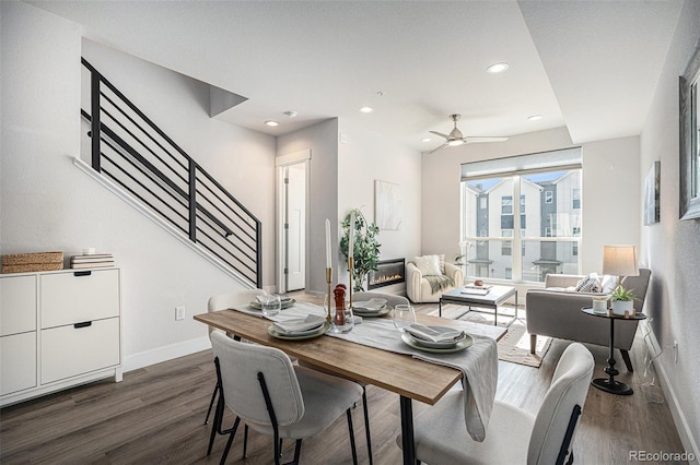 dining space featuring dark wood-style floors, recessed lighting, stairway, ceiling fan, and baseboards