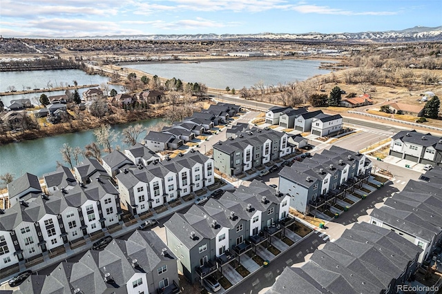 bird's eye view featuring a water view and a residential view