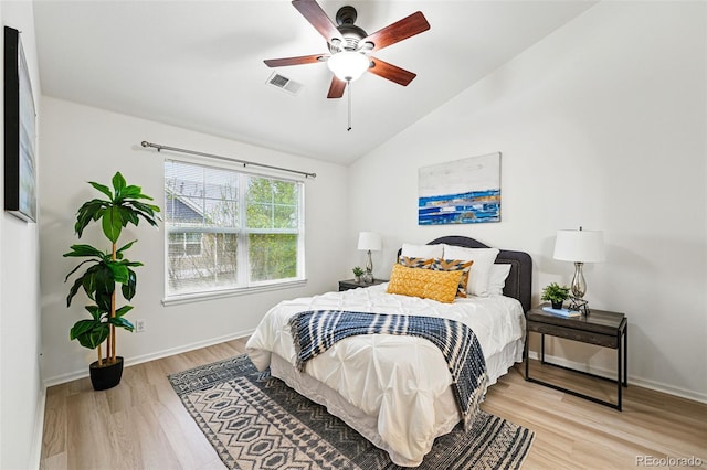 8200 E 8th Ave Unit 5-204, Denver, CO 80230 - bedroom featuring wood finished floors, lofted ceiling, baseboards, and ceiling fan