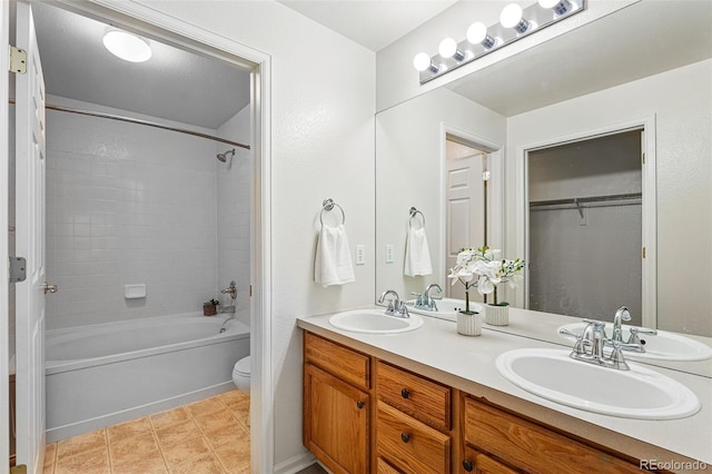 8200 E 8th Ave Unit 5-204, Denver, CO 80230 - bathroom featuring double vanity, toilet, shower / bath combination, and a walk in closet