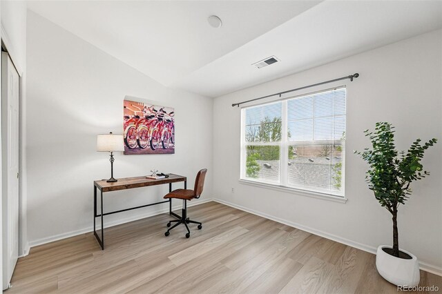8200 E 8th Ave Unit 5-204, Denver, CO 80230 - home office featuring light wood-type flooring, baseboards, and vaulted ceiling