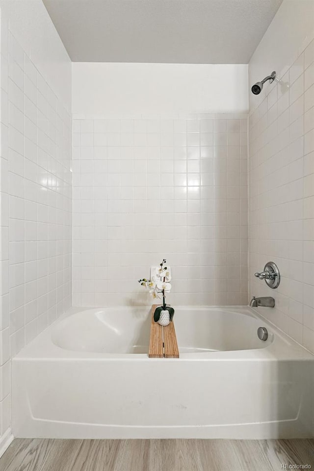 8200 E 8th Ave Unit 5-204, Denver, CO 80230 - full bath featuring wood finished floors and shower / bath combination