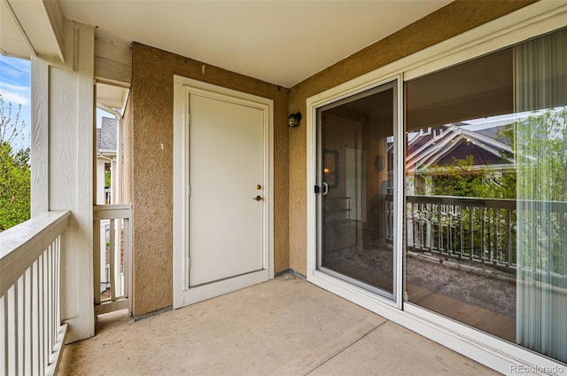 8200 E 8th Ave Unit 5-204, Denver, CO 80230 - doorway to property featuring stucco siding