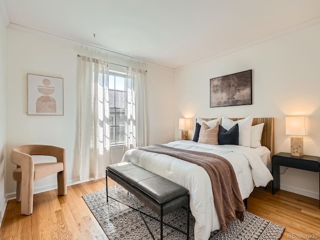 2301 E Fremont Ave Unit W03, Centennial, CO 80122 - bedroom featuring ornamental molding, light wood finished floors, and baseboards