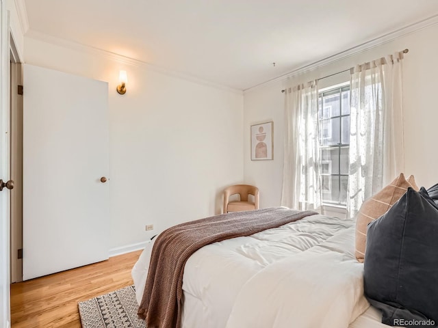 2301 E Fremont Ave Unit W03, Centennial, CO 80122 - bedroom featuring light wood-type flooring and ornamental molding