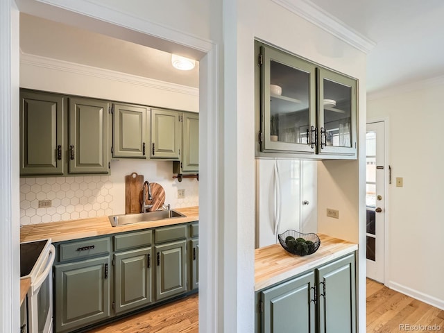 2301 E Fremont Ave Unit W03, Centennial, CO 80122 - kitchen featuring a sink, white electric range, butcher block countertops, crown molding, and tasteful backsplash
