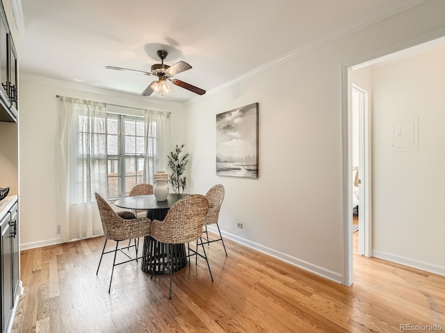 2301 E Fremont Ave Unit W03, Centennial, CO 80122 - dining room featuring ceiling fan, light wood-style flooring, ornamental molding, and baseboards