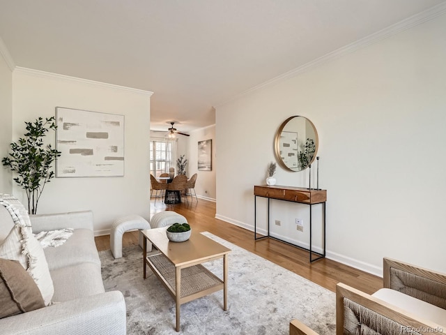 2301 E Fremont Ave Unit W03, Centennial, CO 80122 - living room with ornamental molding, wood finished floors, baseboards, and ceiling fan