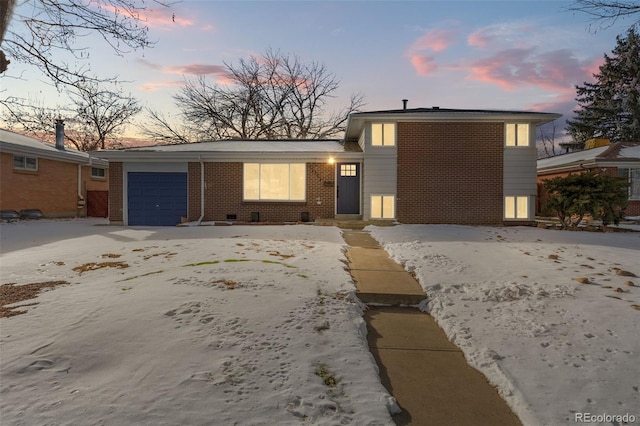 view of front of property with a garage