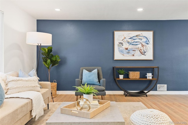 sitting room featuring hardwood / wood-style floors