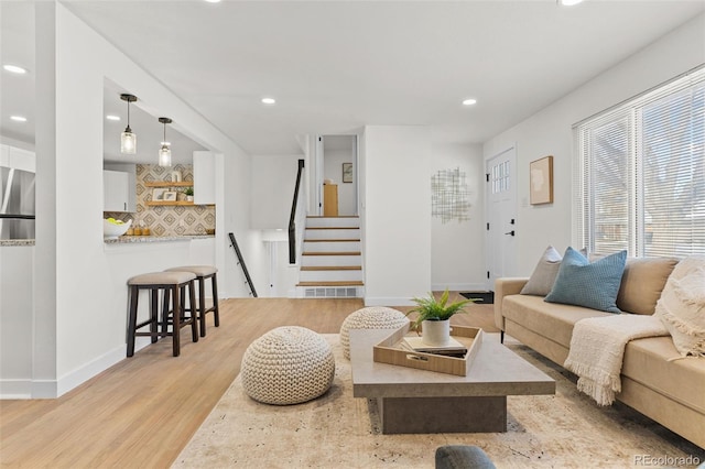 living room with light hardwood / wood-style flooring