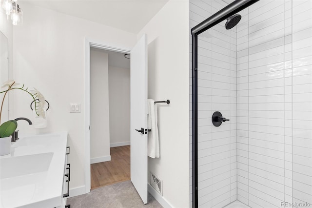 bathroom featuring vanity and walk in shower