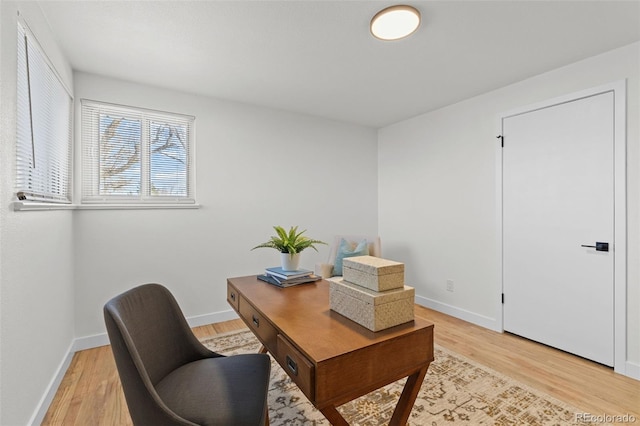 office with light hardwood / wood-style flooring