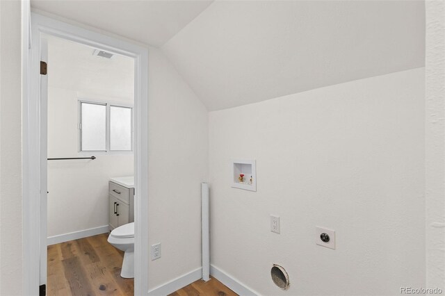 washroom featuring wood-type flooring, hookup for a washing machine, and electric dryer hookup