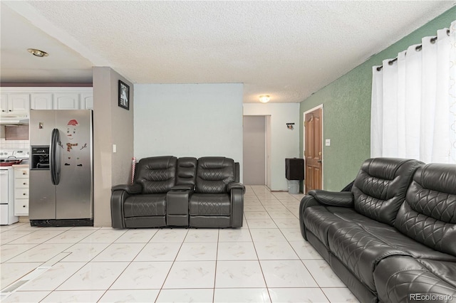 living room with light tile patterned floors and a textured ceiling