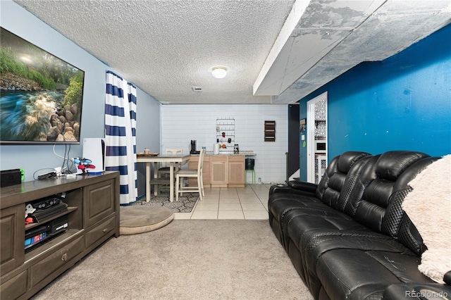 carpeted living room with a textured ceiling