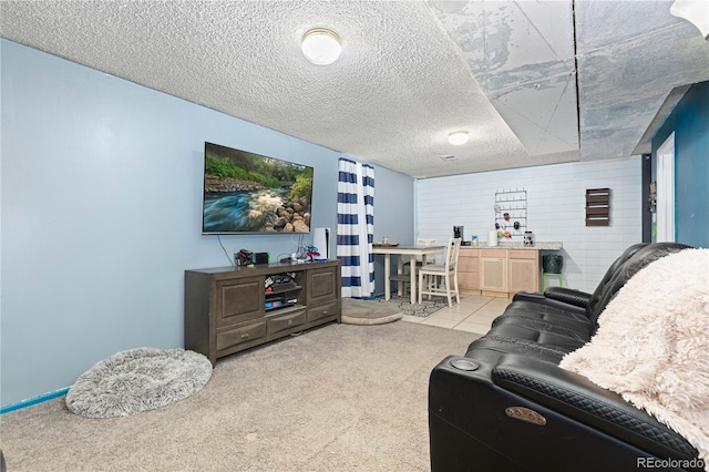 carpeted living room featuring a textured ceiling