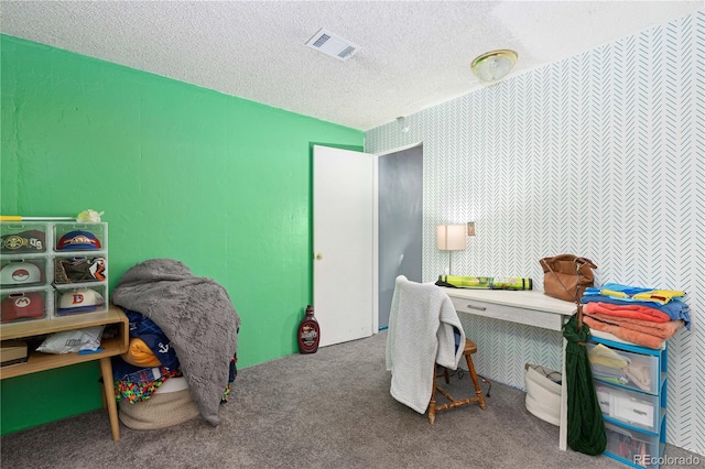 home office with carpet floors and a textured ceiling