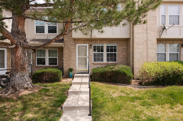 3098 W 107th Pl Unit C, Westminster, CO 80031 - view of front facade featuring a front yard and brick siding