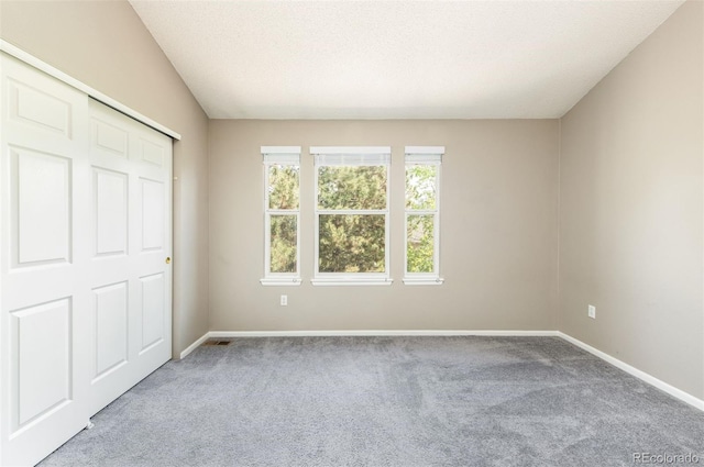3098 W 107th Pl Unit C, Westminster, CO 80031 - unfurnished bedroom featuring carpet flooring, baseboards, and a textured ceiling