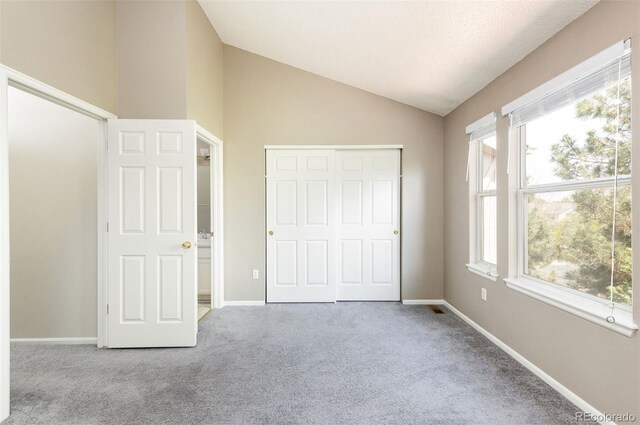 3098 W 107th Pl Unit C, Westminster, CO 80031 - unfurnished bedroom featuring lofted ceiling, carpet, a closet, and baseboards
