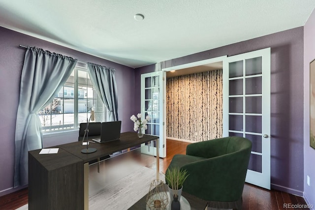 office area featuring dark hardwood / wood-style floors, a textured ceiling, and french doors