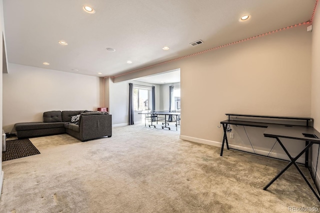 living room featuring light carpet