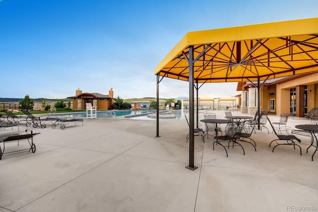 view of patio featuring a community pool