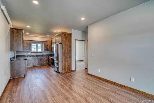 806 S St, Silver Cliff, CO 81252 - kitchen featuring appliances with stainless steel finishes, dark countertops, dark wood-style floors, recessed lighting, and baseboards