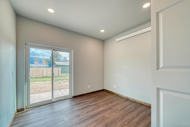 806 S St, Silver Cliff, CO 81252 - empty room with wood finished floors, baseboards, and recessed lighting