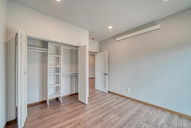 806 S St, Silver Cliff, CO 81252 - unfurnished bedroom featuring wood finished floors, recessed lighting, baseboards, and a closet