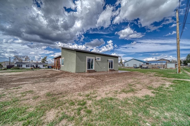 806 S St, Silver Cliff, CO 81252 - rear view of house featuring stucco siding