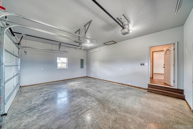 806 S St, Silver Cliff, CO 81252 - garage with electric panel, baseboards, and a garage door opener