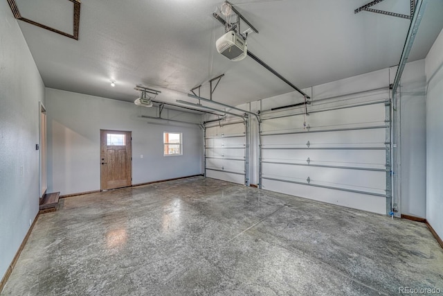 806 S St, Silver Cliff, CO 81252 - garage with a garage door opener and baseboards