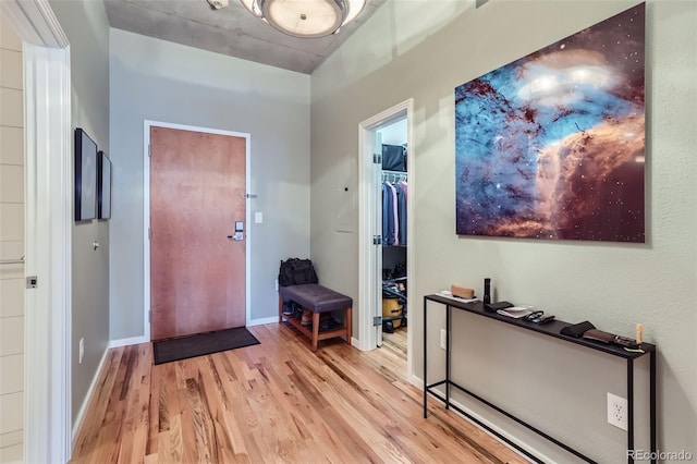 foyer entrance with light hardwood / wood-style floors