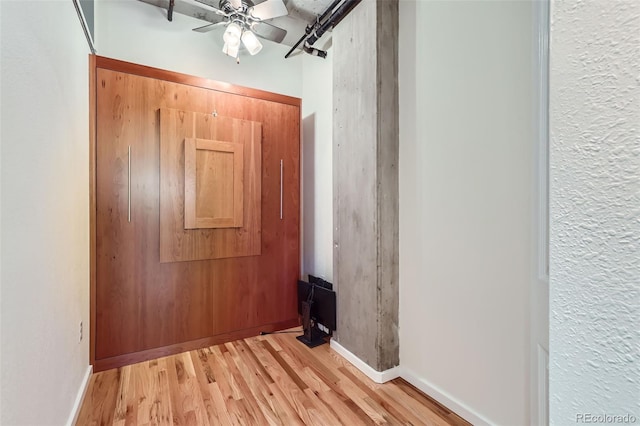 1499 Blake St Unit 5I, Denver, CO 80202 - hallway with light wood-style flooring and baseboards