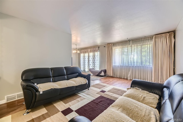 661 S Paris St, Aurora, CO 80012 - living area with a chandelier and wood finished floors